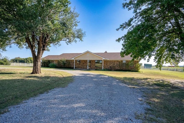 ranch-style house with a front lawn