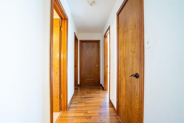 corridor featuring light hardwood / wood-style floors