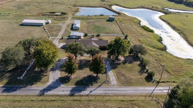 drone / aerial view with a water view and a rural view