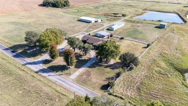 drone / aerial view featuring a rural view and a water view