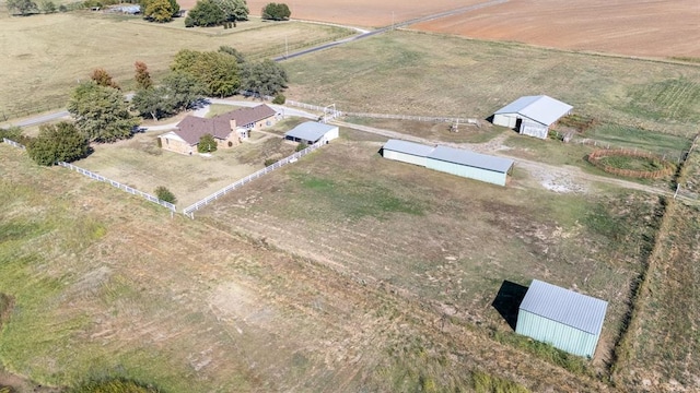 birds eye view of property featuring a rural view