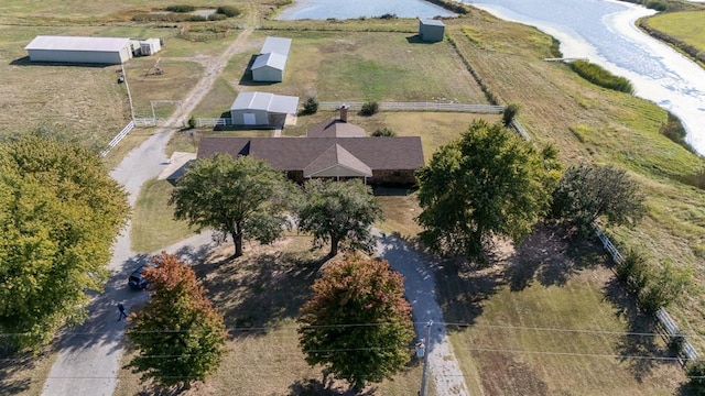 drone / aerial view with a water view and a rural view