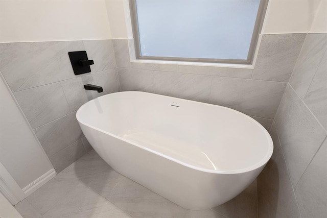 full bathroom with a freestanding bath