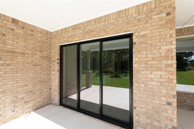 14001 Birch Ln, Edmond, OK 73049 - doorway to outside with brick wall