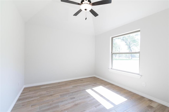 14001 Birch Ln, Edmond, OK 73049 - empty room with lofted ceiling, light wood finished floors, and ceiling fan