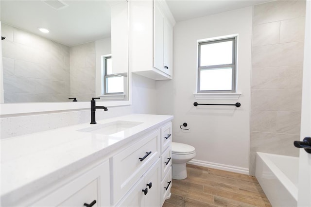 14001 Birch Ln, Edmond, OK 73049 - full bath featuring vanity, wood finished floors, and tub / shower combination