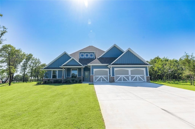 14001 Birch Ln, Edmond, OK 73049 - craftsman house with driveway, a front lawn, stone siding, and an attached garage