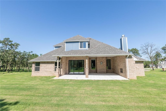 14001 Birch Ln, Edmond, OK 73049 - back of property with a patio, brick siding, a shingled roof, and a lawn