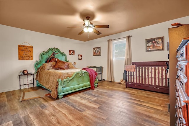 bedroom featuring ceiling fan and hardwood / wood-style flooring