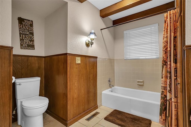 bathroom featuring tile patterned flooring, toilet, and shower / bathtub combination with curtain