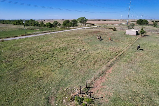 view of yard with a rural view