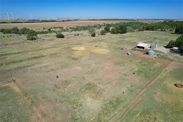 birds eye view of property with a rural view