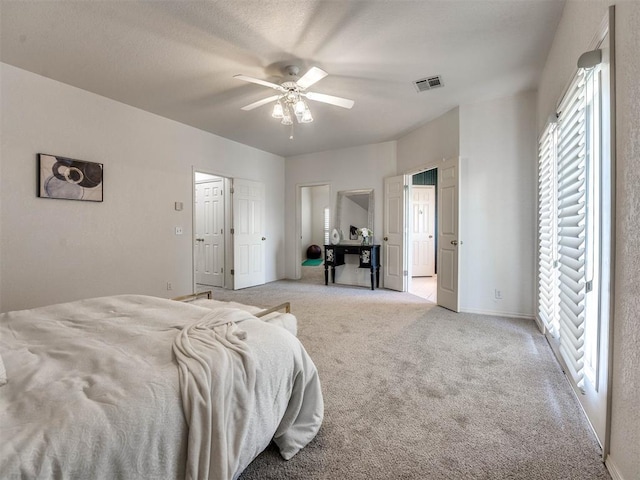 carpeted bedroom featuring ceiling fan