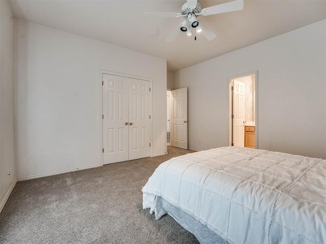 carpeted bedroom featuring a closet, ceiling fan, and ensuite bathroom