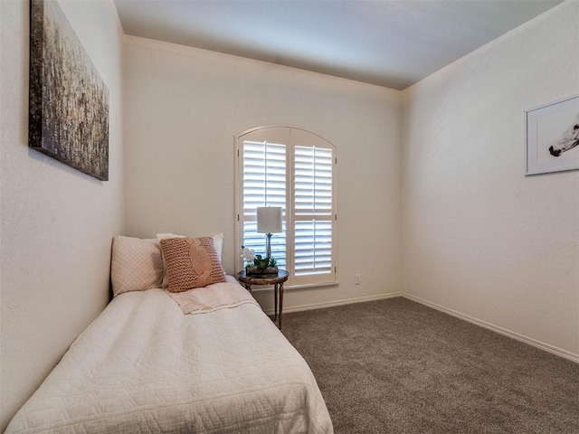 bedroom featuring carpet floors and baseboards