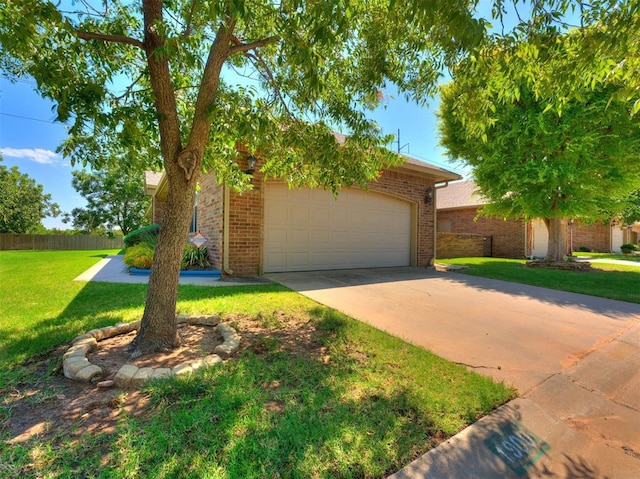 view of front of house with driveway, an attached garage, a front lawn, and brick siding