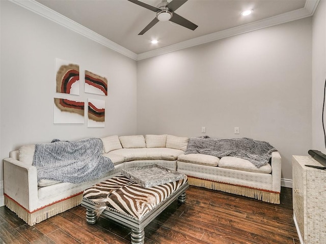 living room featuring dark hardwood / wood-style flooring, ceiling fan, and ornamental molding