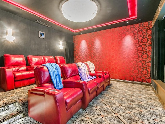 home theater room with a tray ceiling