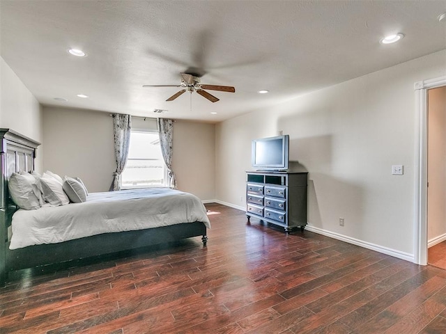 bedroom featuring ceiling fan and dark hardwood / wood-style flooring