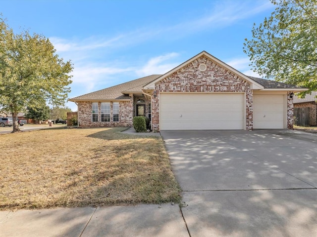 ranch-style house with a front lawn and a garage