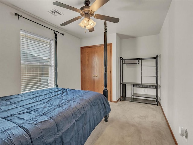 bedroom featuring ceiling fan and light colored carpet