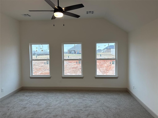 empty room with light carpet, ceiling fan, and lofted ceiling