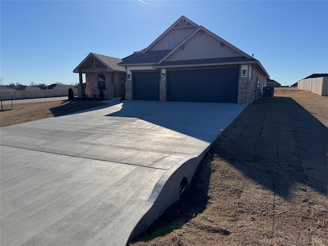 view of front facade with concrete driveway, brick siding, and an attached garage