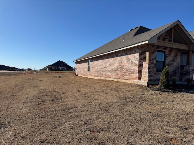 view of home's exterior featuring brick siding