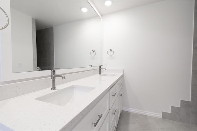 full bath featuring recessed lighting, tile patterned floors, double vanity, and a sink