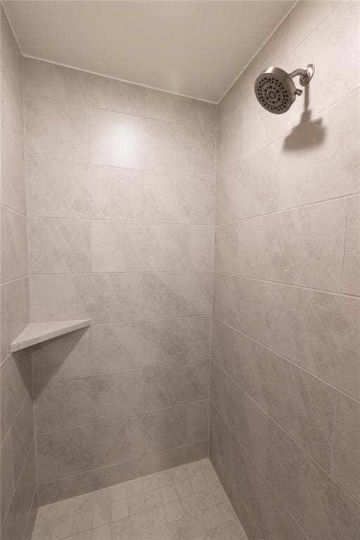 bathroom with tiled shower