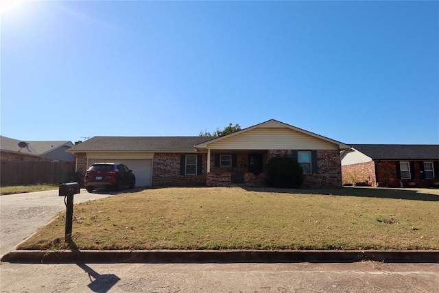 ranch-style home featuring a garage and a front lawn