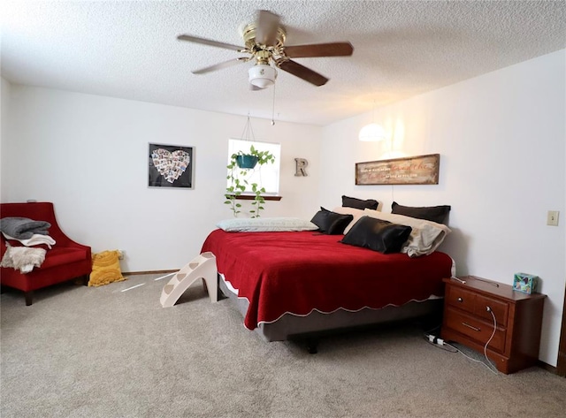 carpeted bedroom with a textured ceiling and ceiling fan