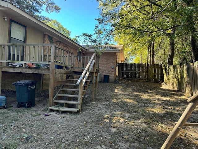 view of yard with a wooden deck