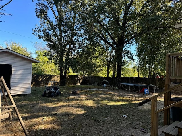 view of yard with a trampoline