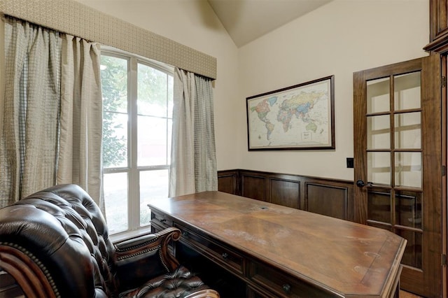 home office with lofted ceiling