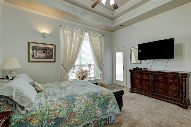 carpeted bedroom with access to exterior, a raised ceiling, ceiling fan, and crown molding