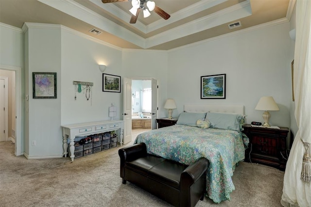 bedroom featuring ceiling fan, light colored carpet, crown molding, and ensuite bath