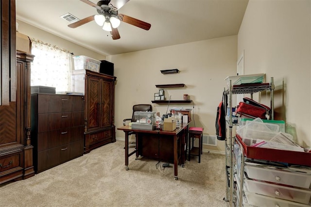 carpeted home office with ceiling fan