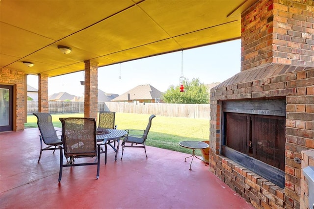 view of patio / terrace with an outdoor brick fireplace