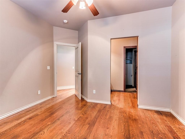 unfurnished bedroom featuring ceiling fan and light hardwood / wood-style floors