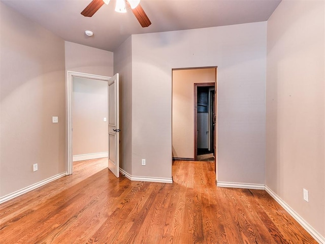 unfurnished room with ceiling fan and light hardwood / wood-style floors