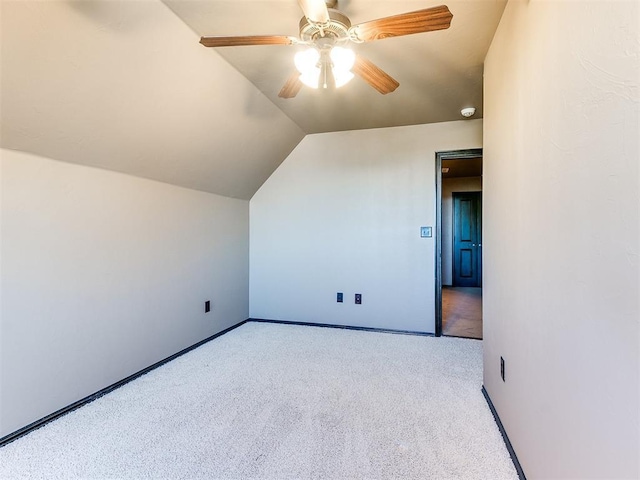 bonus room featuring ceiling fan, light colored carpet, and vaulted ceiling