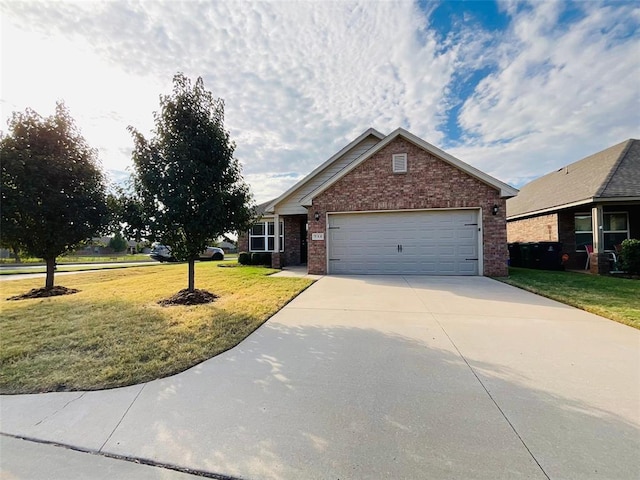 view of front of house with a garage and a front yard