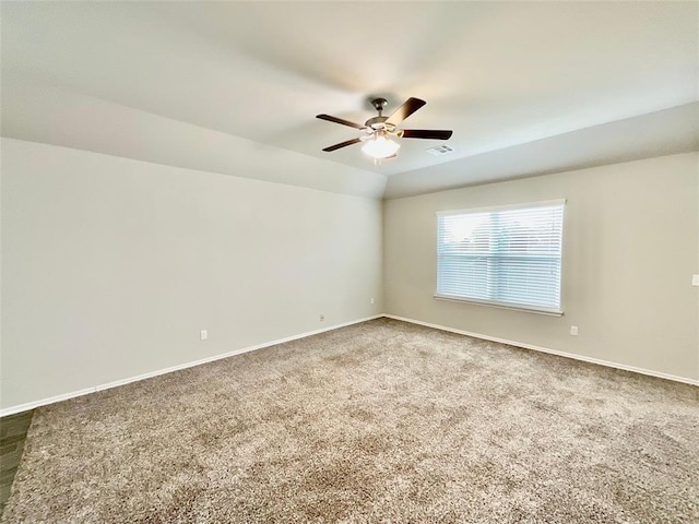 spare room with carpet and ceiling fan