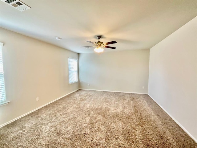 unfurnished room featuring carpet floors and ceiling fan