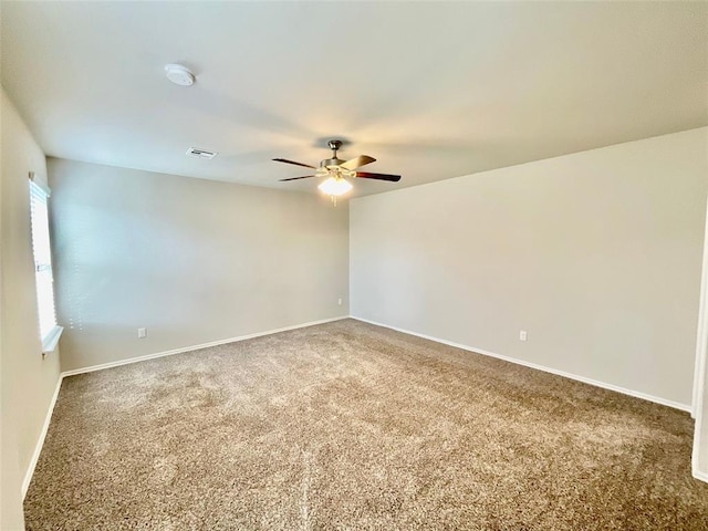 empty room with carpet flooring and ceiling fan