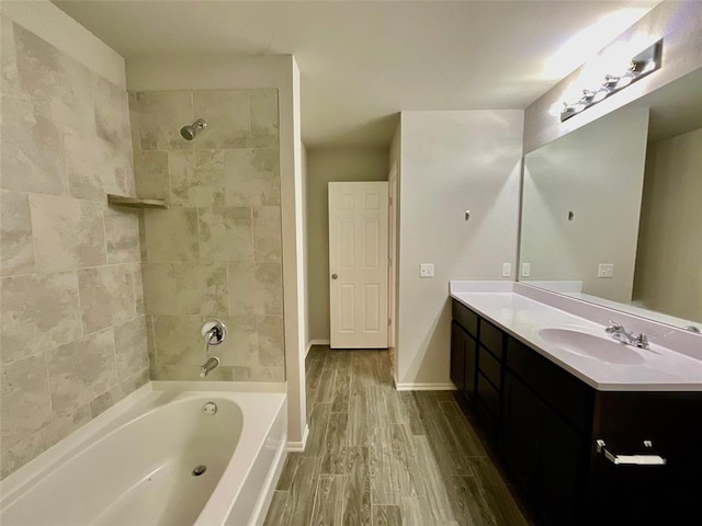 bathroom featuring vanity and tiled shower / bath combo