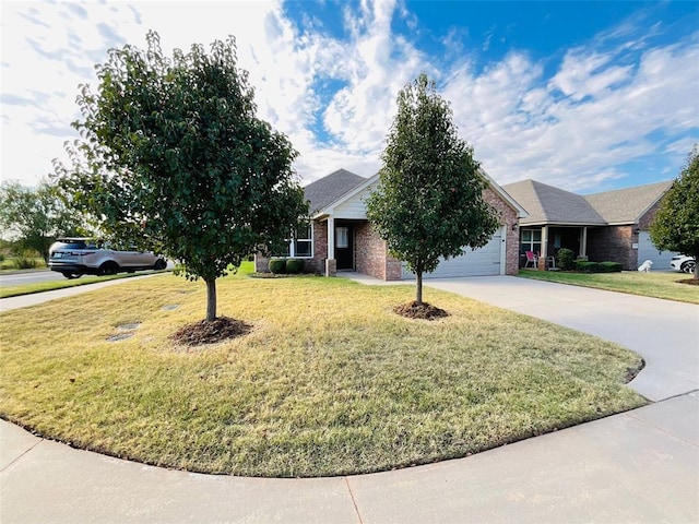 view of front of house with a front yard and a garage