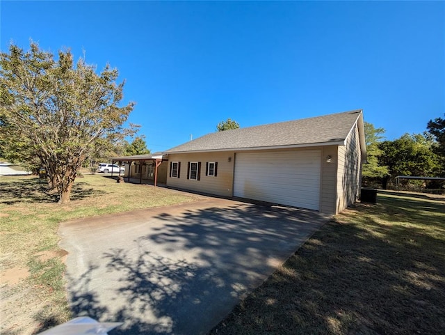 ranch-style house with a garage and a front lawn