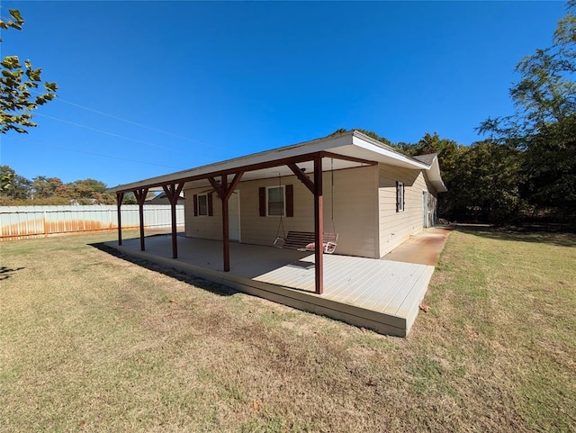 back of property featuring a yard and a patio